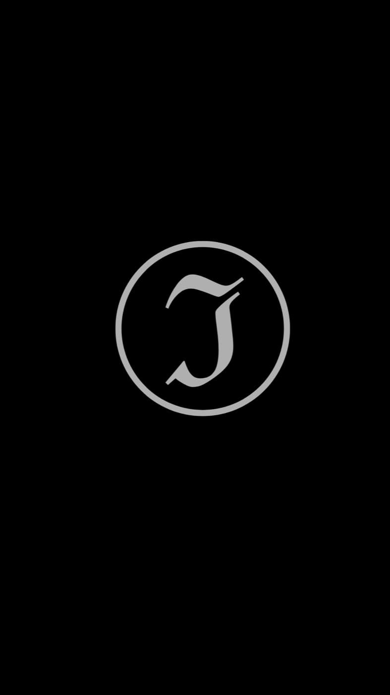 An earlier Icarus mark: a serif J monogram centered inside a plain circular ring, gray on black.